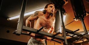 Athlete performing bar dips to train the triceps