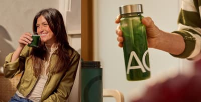 Person drinking a glass of daily greens powder for health and performance