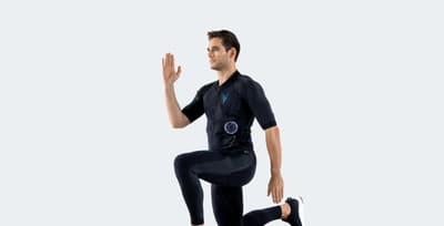Athlete wearing an Antelope EMS suit doing Lunges