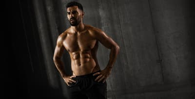 Athlete with visible six-pack abs, the rectus abdominis revealed by low body fat