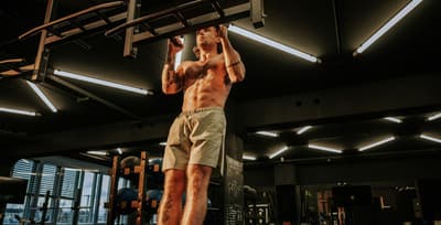 Athlete performing pull-ups showing activation of skeletal muscle and muscle fibers