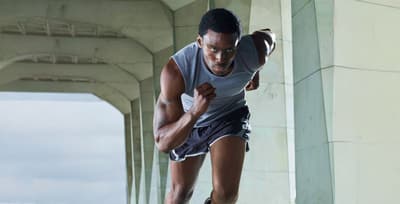 Athlete sprinting on a track as part of a sports conditioning workout