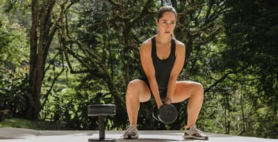 Athlete training outdoors in the summer sun with healthy, sun-kissed skin