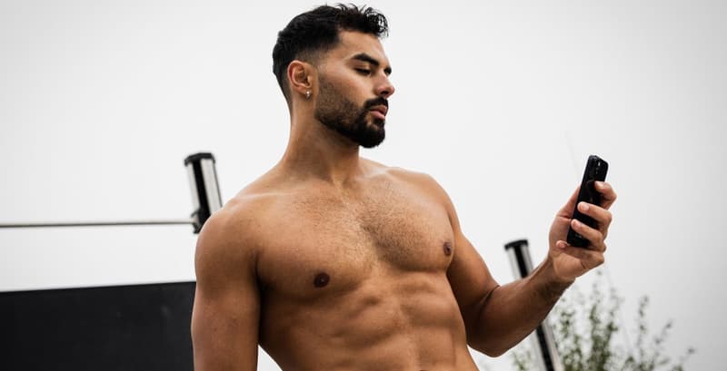 Athlete reviewing their personalized workout plans on a phone to track fitness goals.