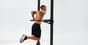 An athlete performing parallel dips as part of a calisthenics workout.