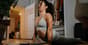 Person doing gentle evening yoga at home to relax and improve sleep quality