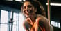 Woman smiling after a workout, showing the mood boost from exercise and happy hormones.