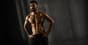 Athlete with visible six-pack abs, the rectus abdominis revealed by low body fat